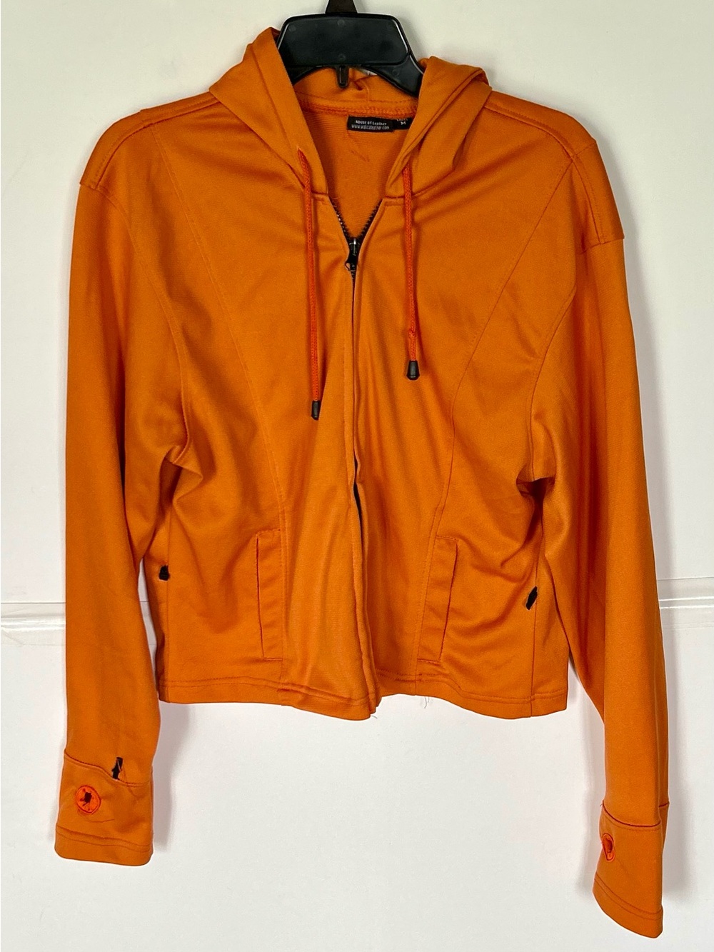 House of Leather woman’s LS orange hoodie with zip front and pockets. Size M